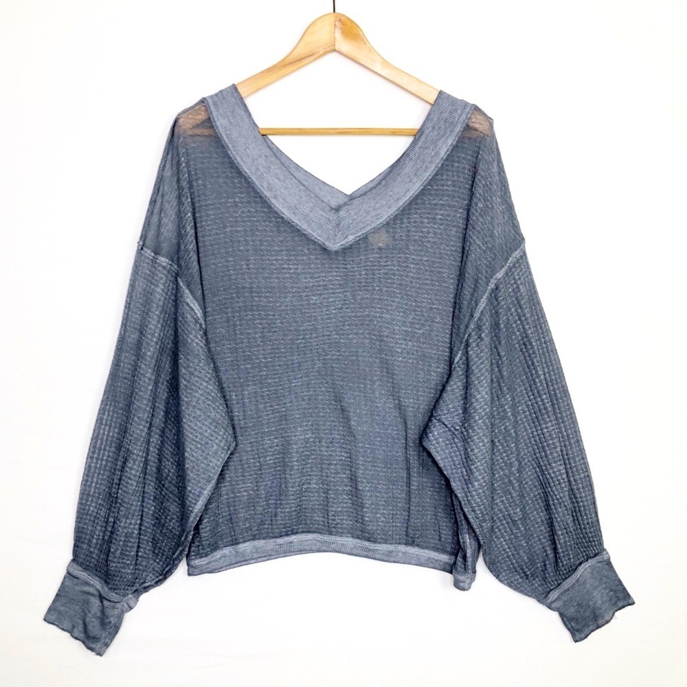 Free people with a free, gray, sheer oversized top
